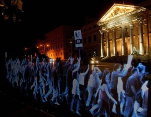 We Are Not Crime – Thousands Protest Spain’s Gag Law As Holograms (VIDEO)